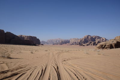 Scenic view of desert against clear sky