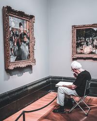 Man sitting on chair at home