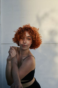 Young alternative redhead girl's portrait at sunset