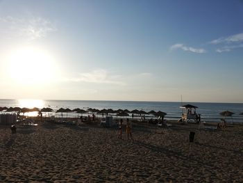 Scenic view of beach against sky during sunset