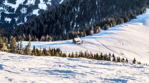 Scenic view of snow covered land and mountains