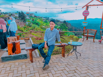 Portrait of young man against plants