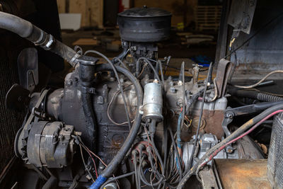 Close-up of car engine in garage