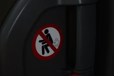 Close-up of red sign on wall