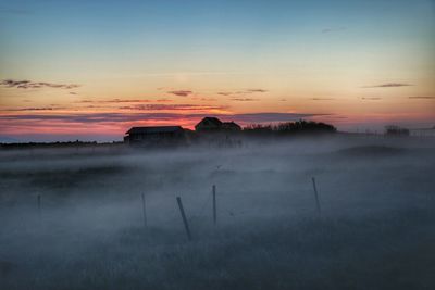 Scenic view of landscape at sunset