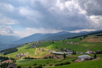 Scenic view of landscape and mountains against sky