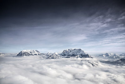 Scenic view of snowcapped mountains against sky