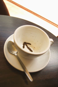 High angle view of coffee cup on table