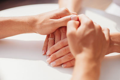 Close-up of hands touching baby