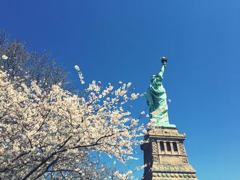 Low angle view of built structure against clear blue sky