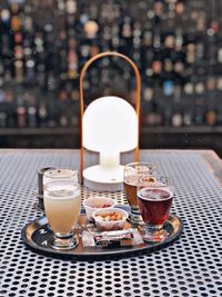 Glass of coffee served on table at cafe