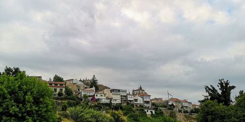 Buildings in city against sky