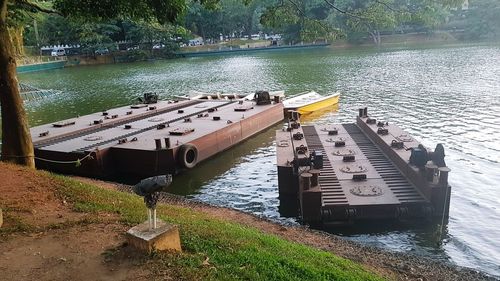 View of boats moored in river