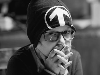 Close-up portrait of young man smoking cigarette