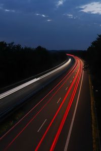 High angle view of light trails on road at night