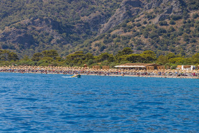Scenic view of sea against mountain