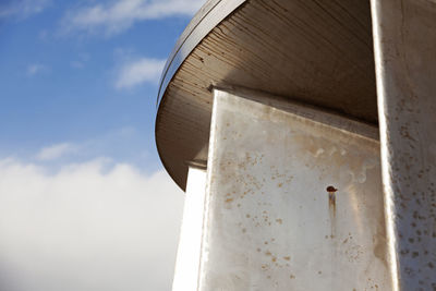 Low angle view of white wall against sky