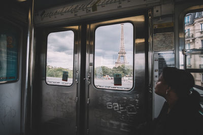 Man seen through train window