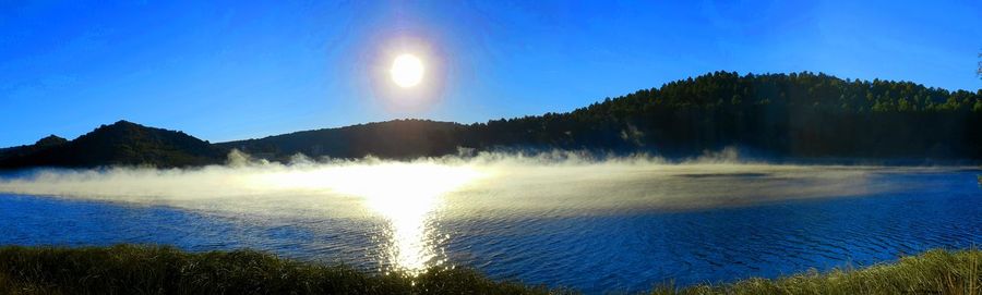 Panoramic view of waterfall against sky