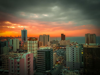 High angle view of buildings against sky during sunset