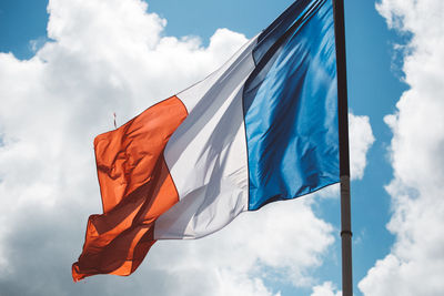 Low angle view of flag against sky