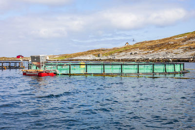 Fish cages in the sea at the coast in norway