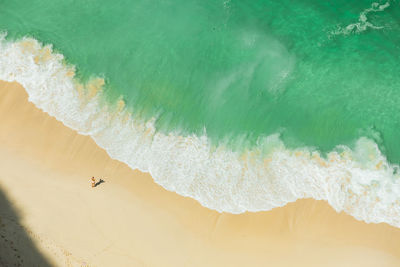 Aerial view of woman standing on beach