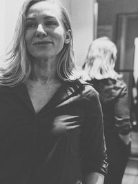 Portrait of woman with dog at home