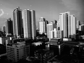 Buildings in city against sky