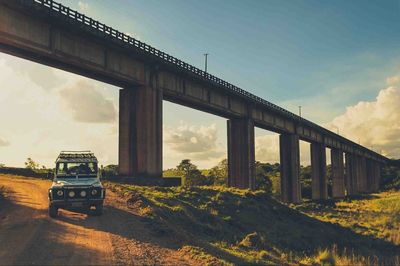 View of bridge against cloudy sky