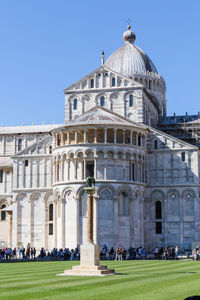 Group of people in front of historical building