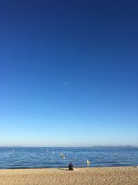 Scenic view of sea against blue sky