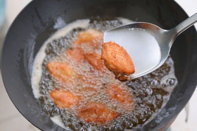 High angle view of meat in cooking pan