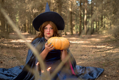 Rear view of man with pumpkin