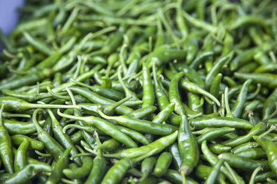 Green chili peppers for sale in market