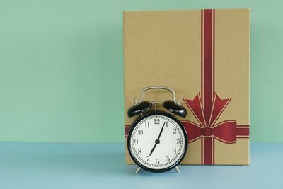 Close-up of clock against blue background