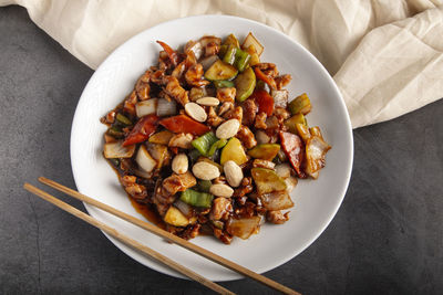 Oriental chicken with almonds. typical chinese food