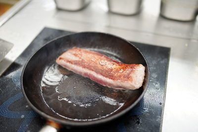 High angle view of meat in cooking pan