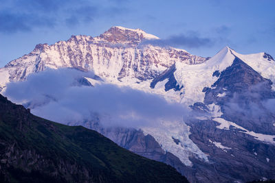 Scenic view of snowcapped mountains against sky