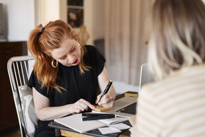 Women working together at home