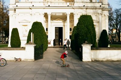 People walking in front of building