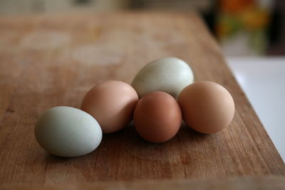 Close-up of eggs on wood