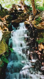 Close-up of waterfall in forest