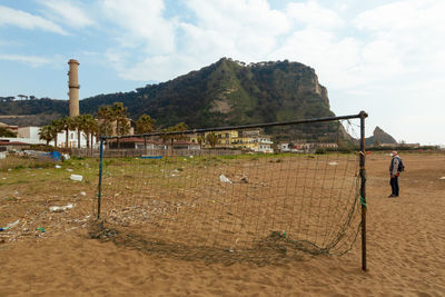 Man on beach against sky