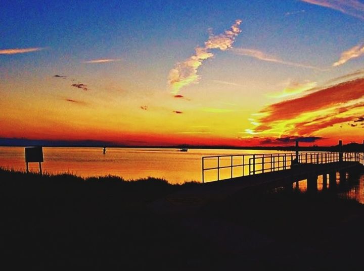 SCENIC VIEW OF BRIDGE AGAINST SKY AT SUNSET