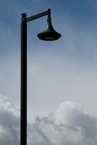 Low angle view of street light against sky