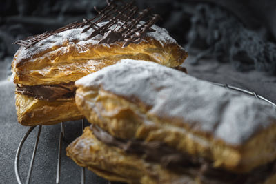 Puff pastry with confectioner's sugar and chocolate filling