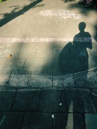 High angle view of man walking on street