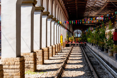 Railroad tracks amidst buildings