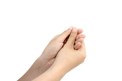 Close-up of hand touching finger against white background